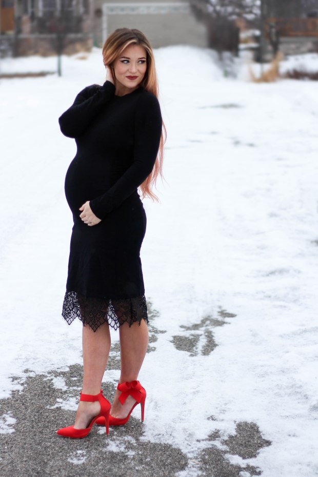 Wearing this black lace dress with red heels for date night! This dress ins't a maternity dress but it does have enough stretch in it to work with the bump!